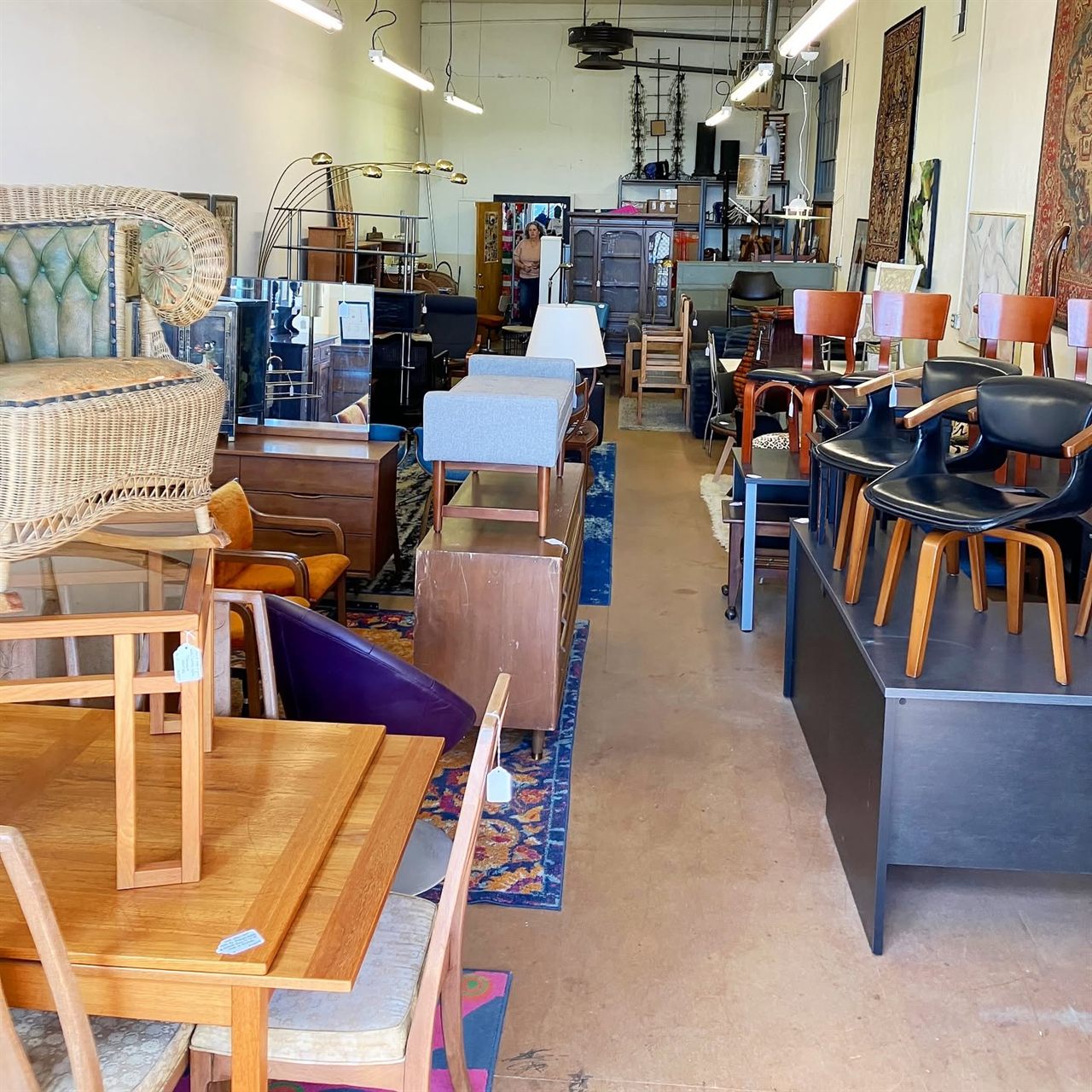 Wide view of the Vintage 101 furniture department with chairs, dressers, tables, and rugs