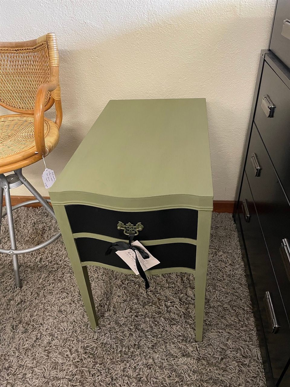 Sage green chalk-painted side table with black drawers