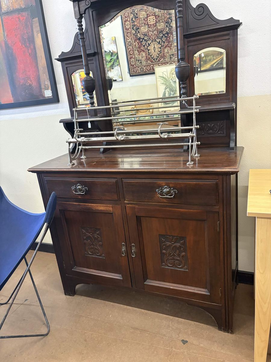 Carved Edwardian mahogany sideboard with a mirrored back and silver gallery rack